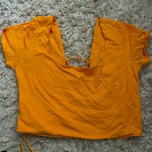 orange crop top with a cross back from papaya